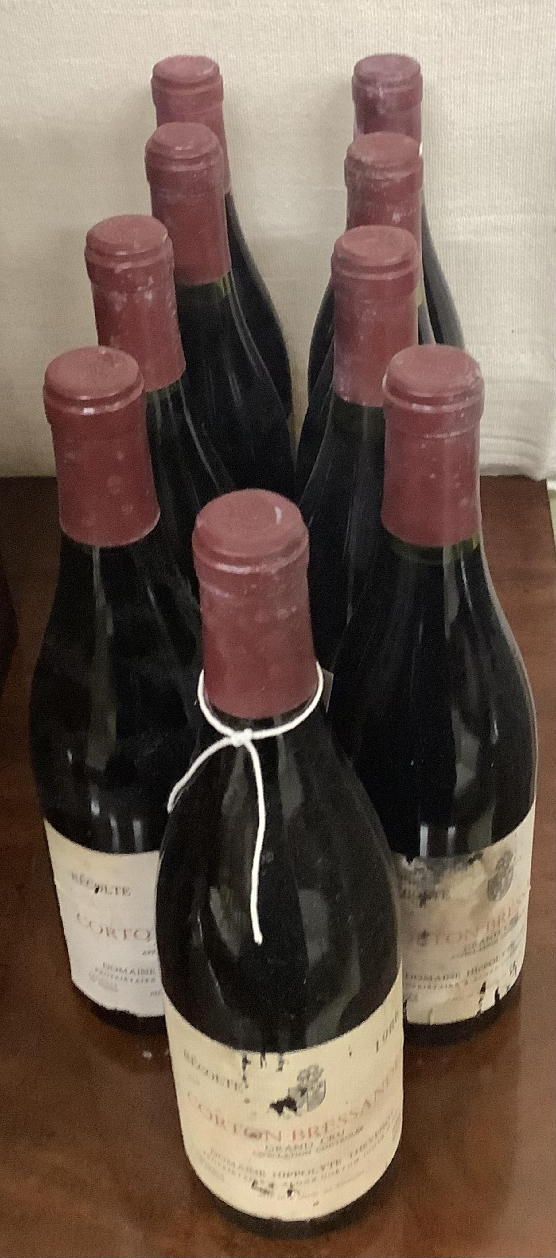 Nine bottles of Domaine Hippolyte Thevenot Corton Bressandes, Recolte Grand Cru 1986. Condition - fair, from a local private cellar